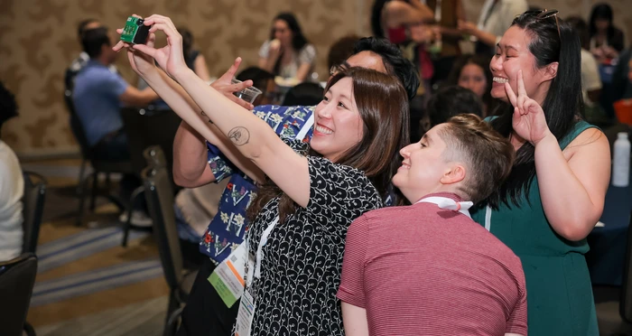 Spectrum Scholars take a selfie with film camera