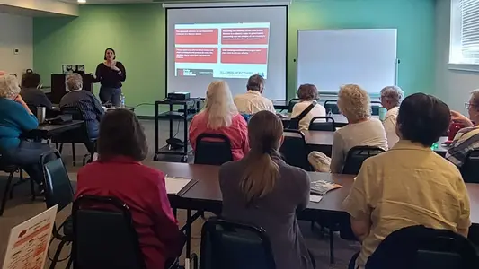 Amanda Kordeliski speaking at an Osher Lifelong Learning Institute Tulsa Town Hall on banned books and censorship