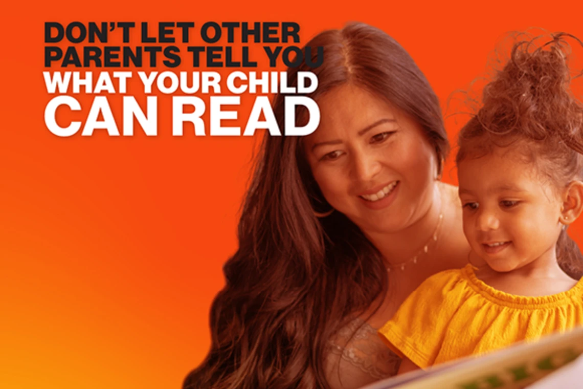 Hispanic mother reading to child. Don't let other parents tell you what your child can read.